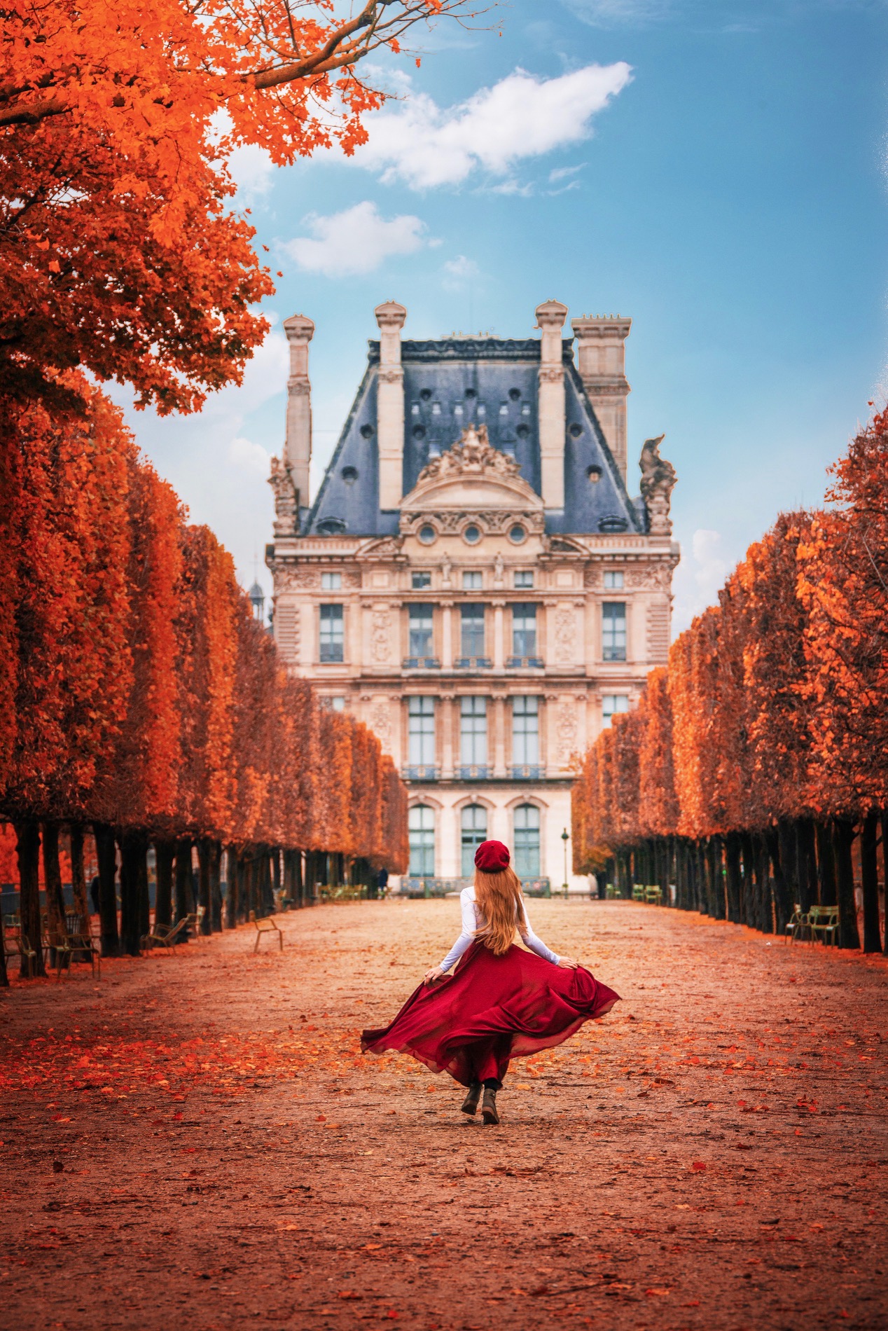 woman walking down autumn scene in paris