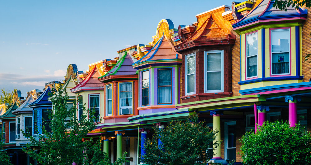 Colorful street of row homes best airbnbs in baltimore