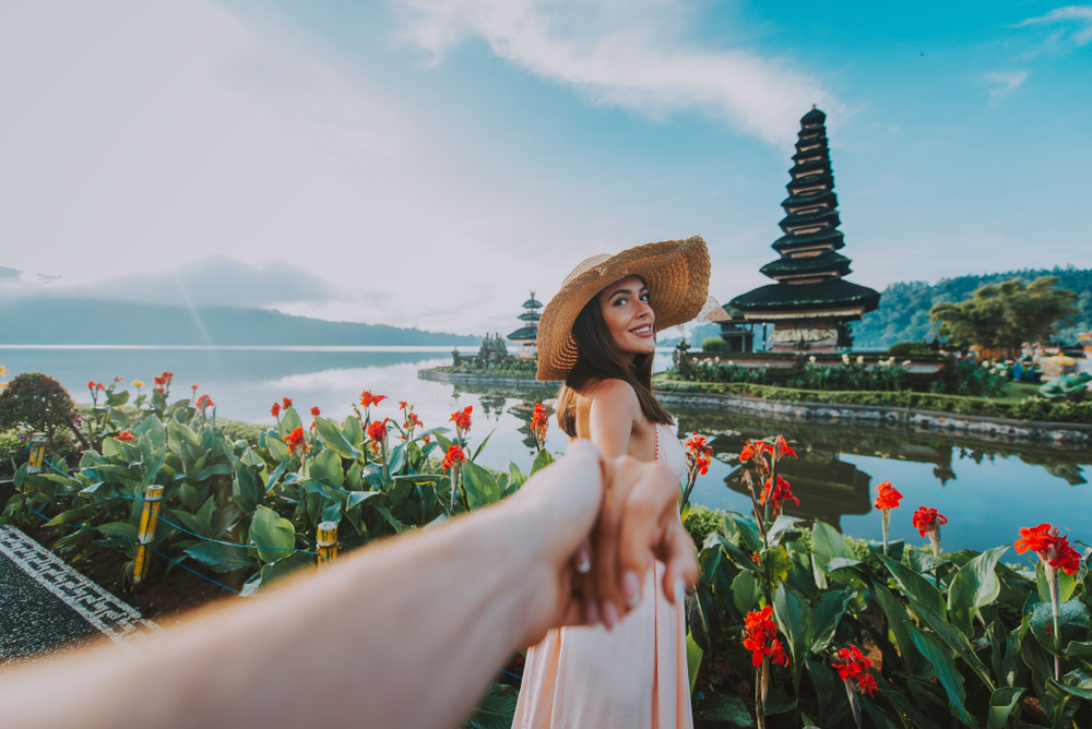 Couple spending time at the ulun datu bratan temple in Bali. One of the best vacation spots for couples. 