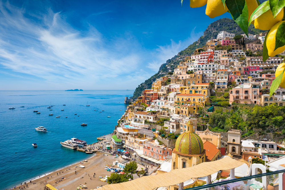 Aerial view of Positano with comfortable beach and blue sea on Amalfi Coast in Campania, Italy.