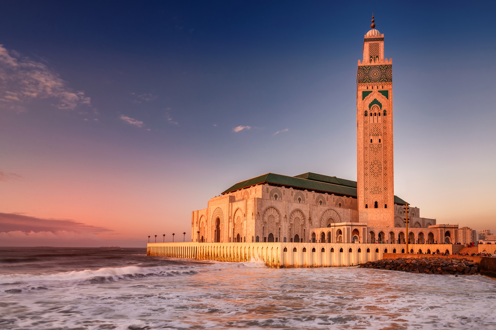 The Hassan II Mosque largest mosque in Morocco. Shot after sunset at blue hour in Casablanca. One of the best vacation spots for couples.