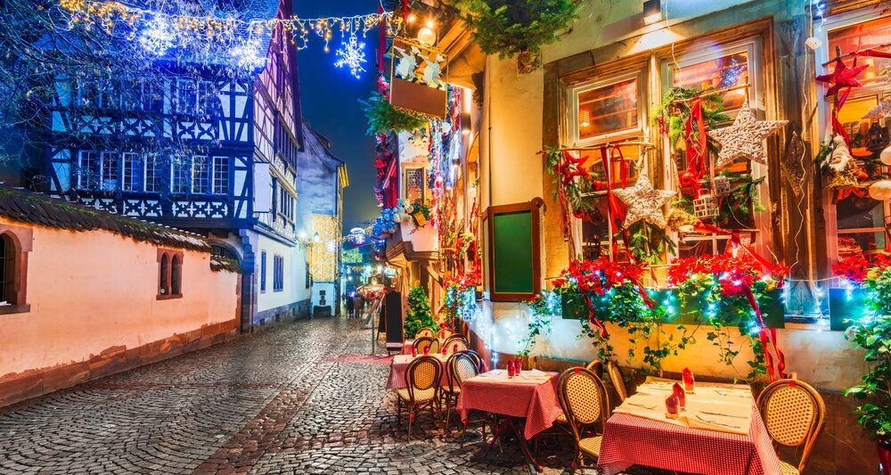 Strasburg, one of the best Christmas cities in Europe, shows a pop up Christmas Market decked out in lights in front of their squares and buildings that feature famous architecture.