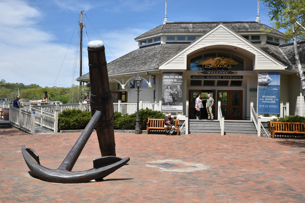 During a Connecticut fall foliage road trip you may want to check out the Mystic Seaport Museum, which is on the coast and is noticeable with its entrance because there is a huge anchor in front of the stairs! 