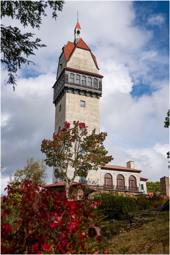 The Heublien Tower in Talcott Mountain State Park is tall with grey stone, and red lining: this observation tower overlooks and offers great panoramic views of foliage. 