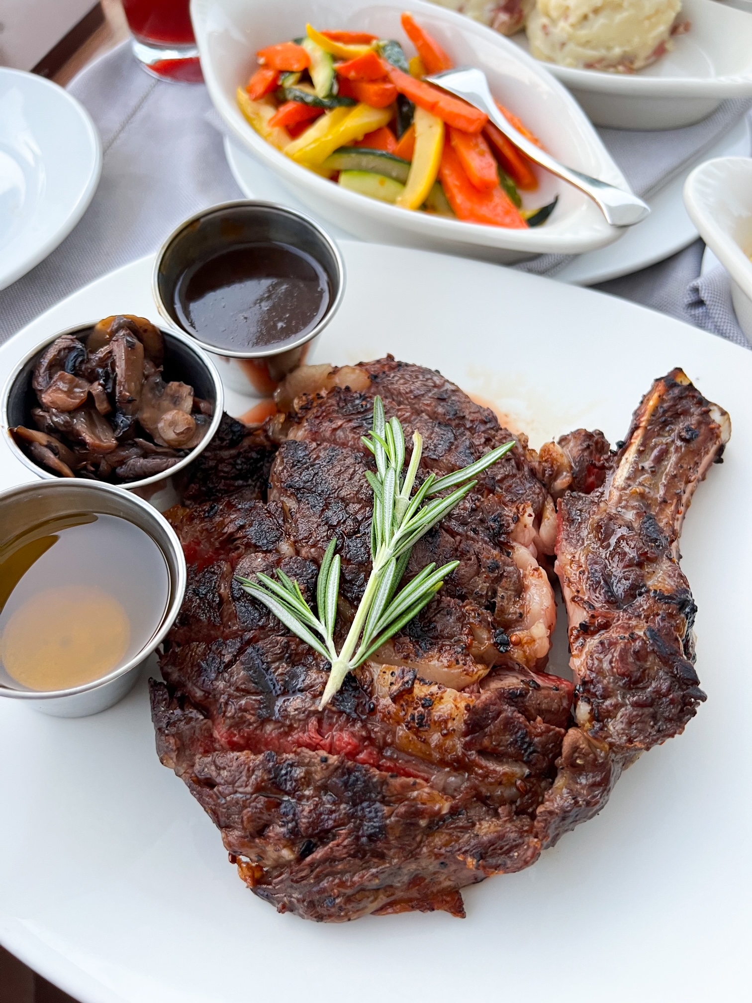 a steak and roasted veggies at Bogie's upscale restaurant