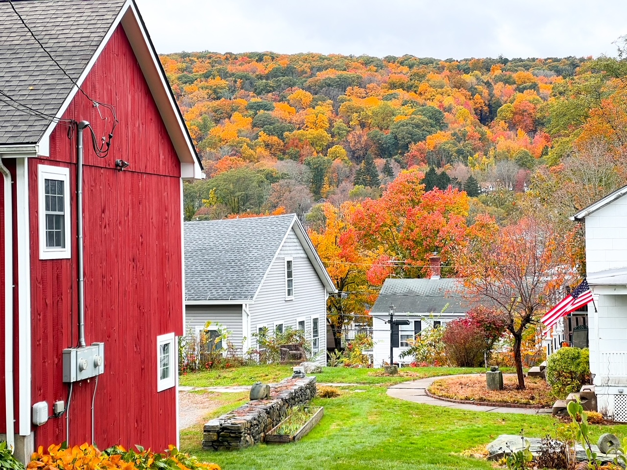 The houses up North are historic are fun to explore: a red barn and the surrounding white homes add accents to the fall foliage. Don't be afraid to see the areas during your New England Fall Foliage Road Trip Itinerary. 