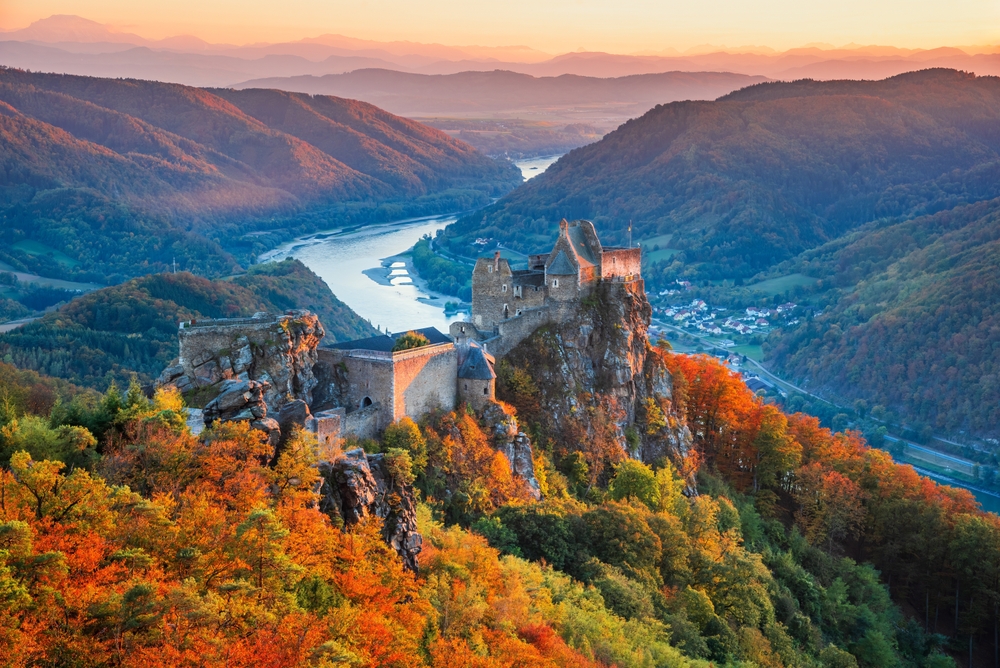 Autumn In Europe - Burg Aggstein, Austria. Beautiful landscape with Aggstein castle ruin and Danube River at sunset in Wachau valley Austria.