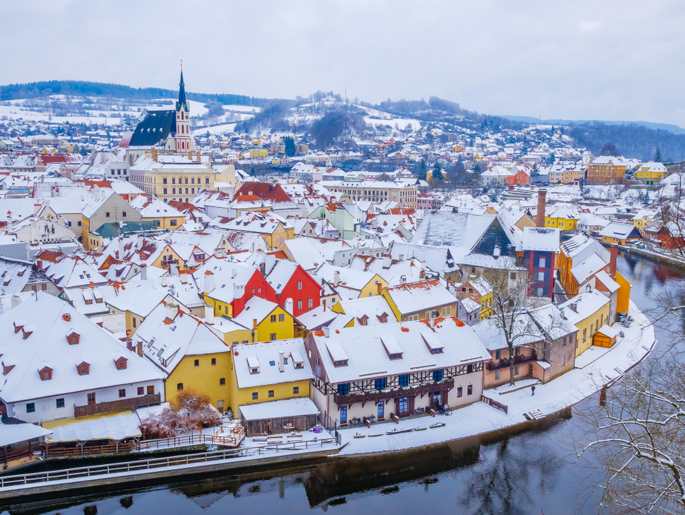 Cesky Krumlov is one of the best Christmas towns in Europe: the snow capped landscape and homes really set the tone for a winter wonderland, and the bright yellow and red buildings make the place feel cozy. 