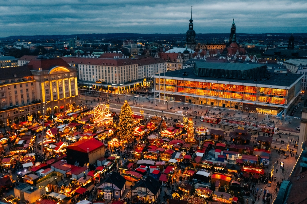 An arial shot of Dresden shows the town all a glow with Christmas lights during a market, which helps rank itself as one of the best Christmas towns in Europe.