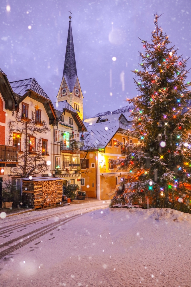 A fairytale type photo of Hallstatt proves it is one of the best Christmas towns in Europe: with stunning small town architecture and natural Christmas trees in white powder on the street, it is all natural and all real. 