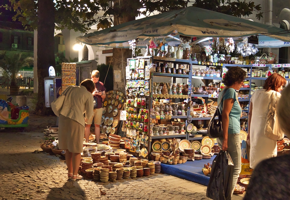 Although Sozopol is not a common Christmas town, it is one of the best Christmas towns in Europe because of the local cuisine that is brought in by the ports: guests lean over markets and explore in this photo. 