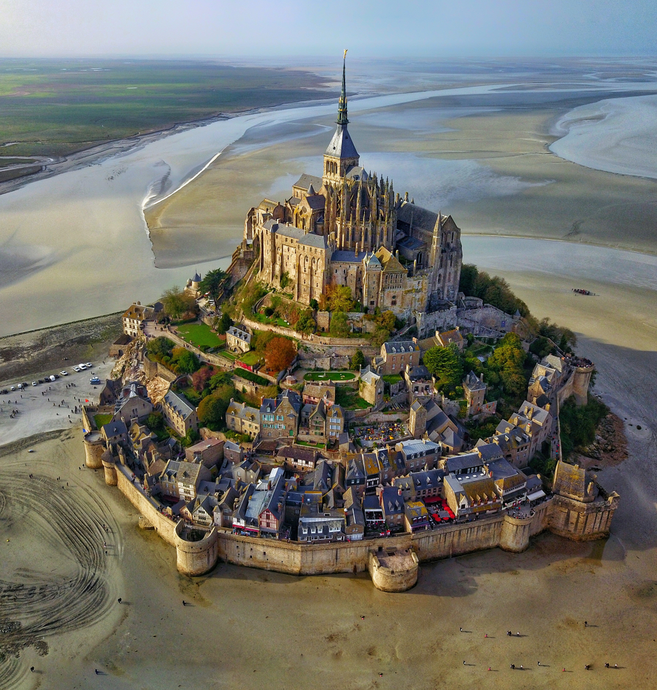 mont saint michel, one of the best things to do in europe, the island is surrounded by water on most sides, image was taken at low tide