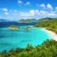 beautiful island with blue water and beach with palm trees