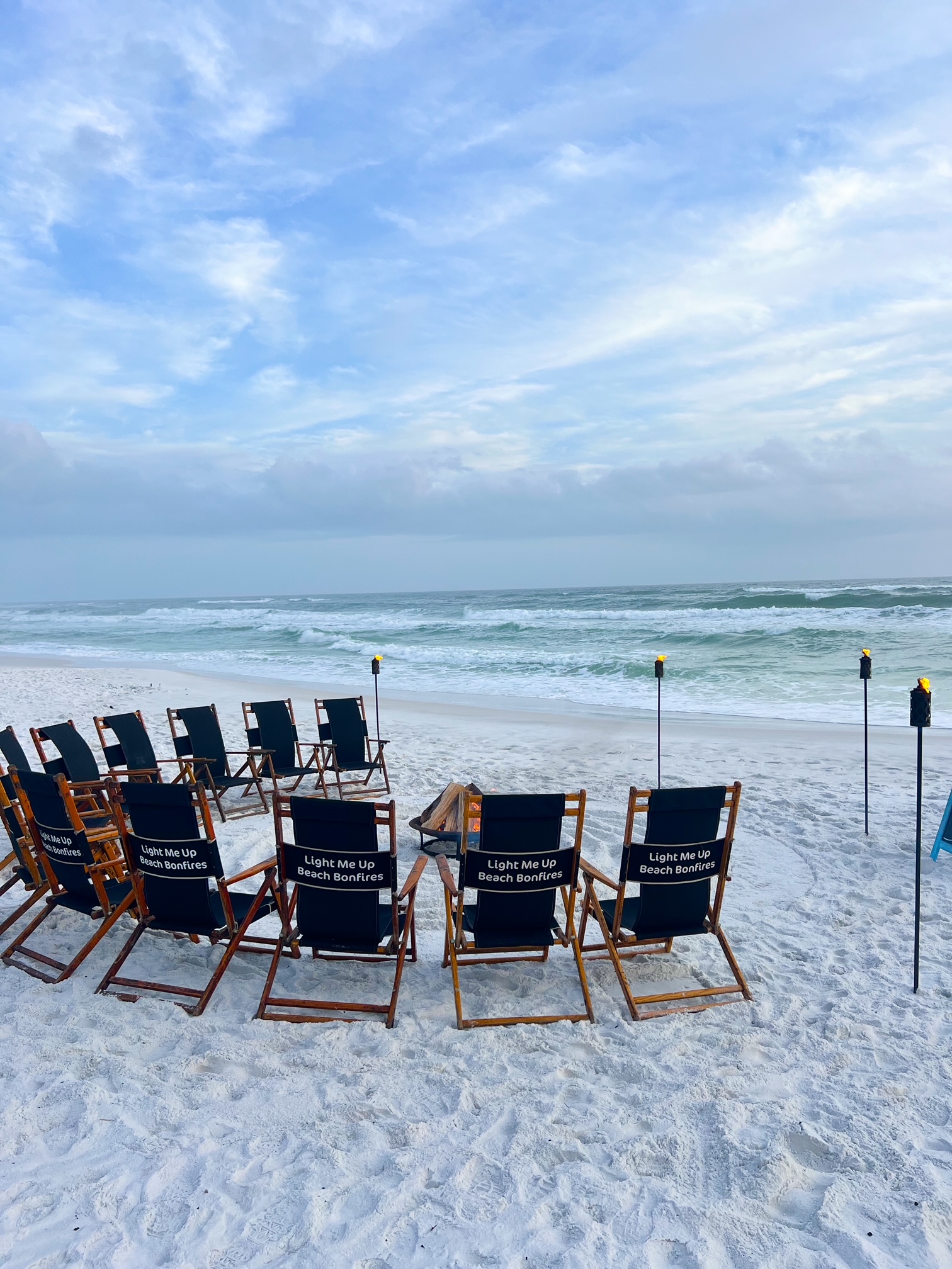 a beach bonfire with chairs set up on the beach is a must on things to do in 30A