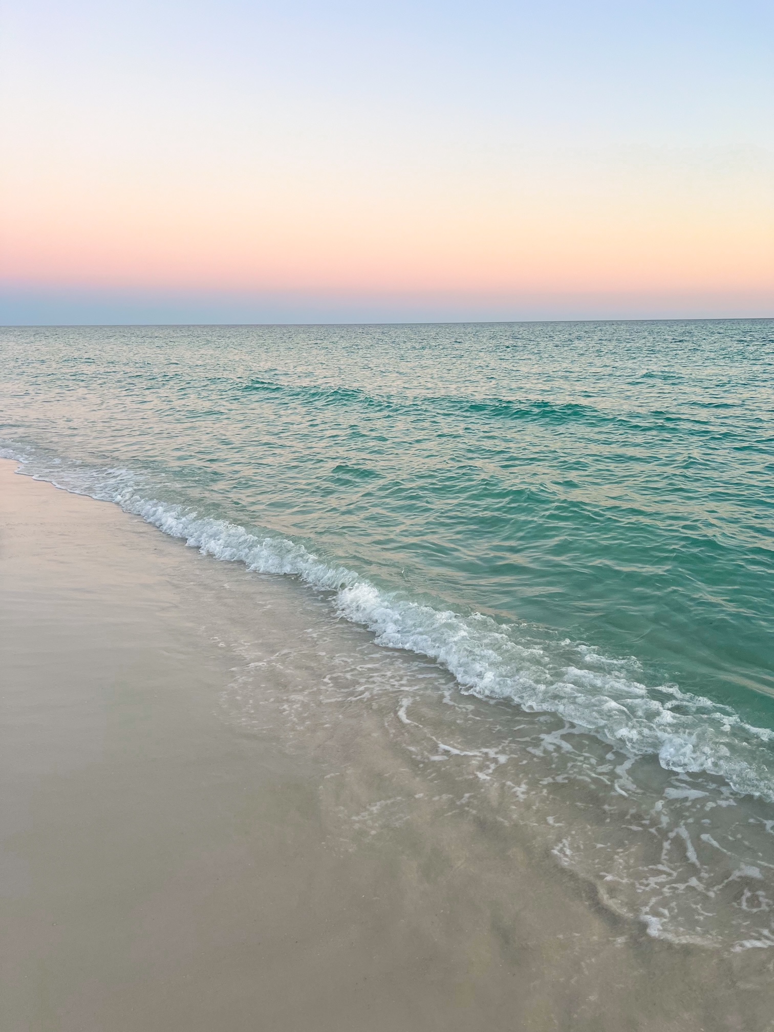 A view of the beach at sunset