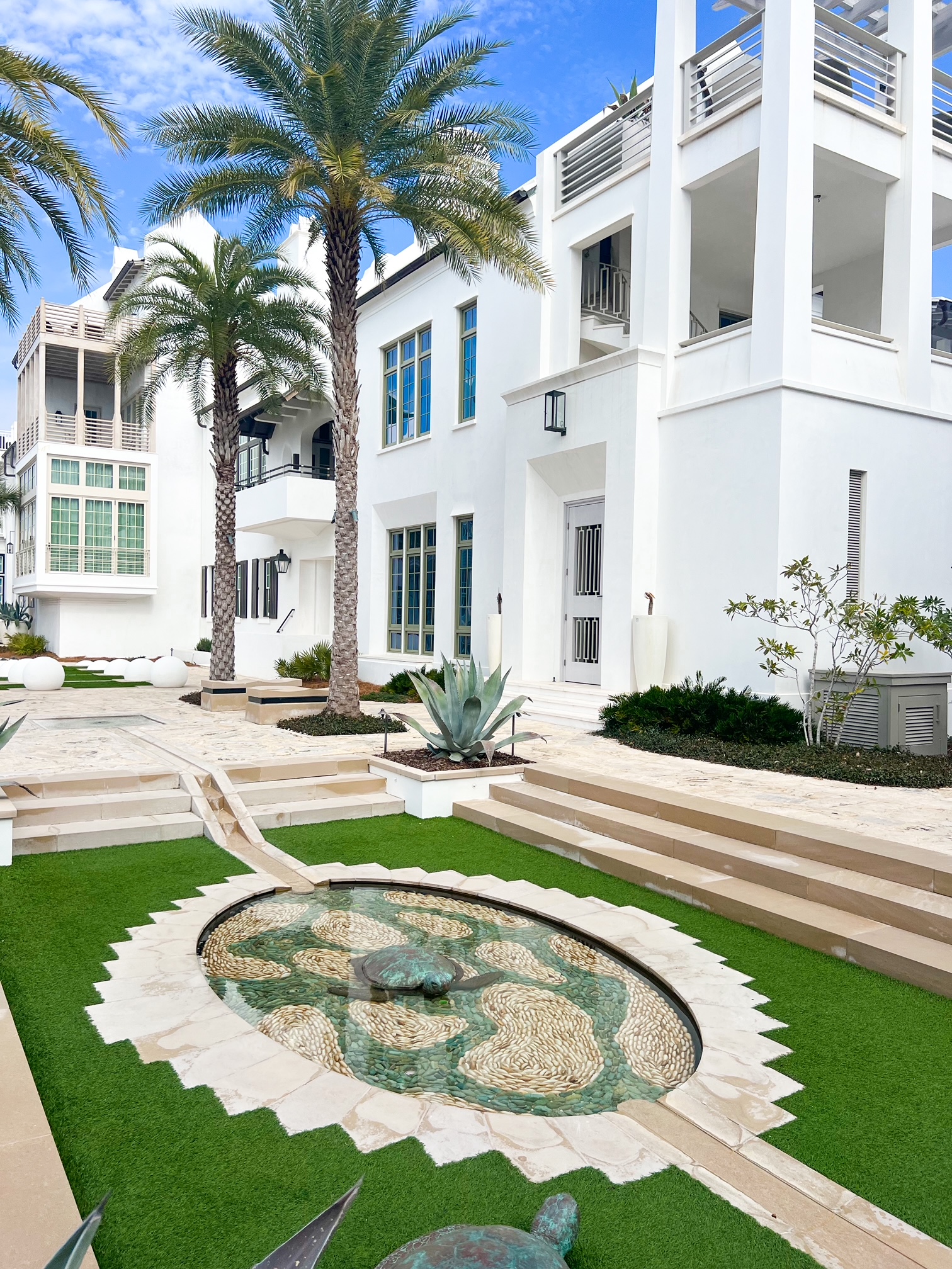 The trees and green spaces inside Alys Beach town along 30A