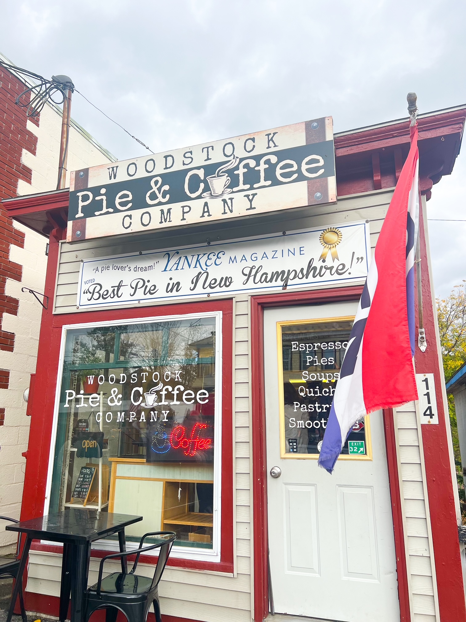 A sign of the Woodstock Pie and Coffee company shows off the best pie in new Hampshire-- the red, wooden building has been around forever and makes the best pies! 