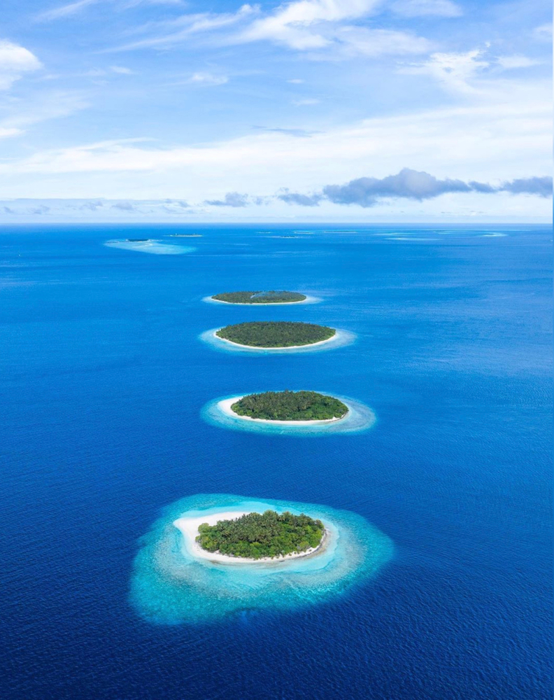 Maldives from the aerial view you can see the lush islands.  