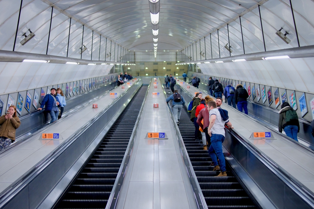 A low angle shot of some passengers on the the escalator at Holborn Tube station, London, the UK. Stand on the right one of the mistakes to avoid in London. 