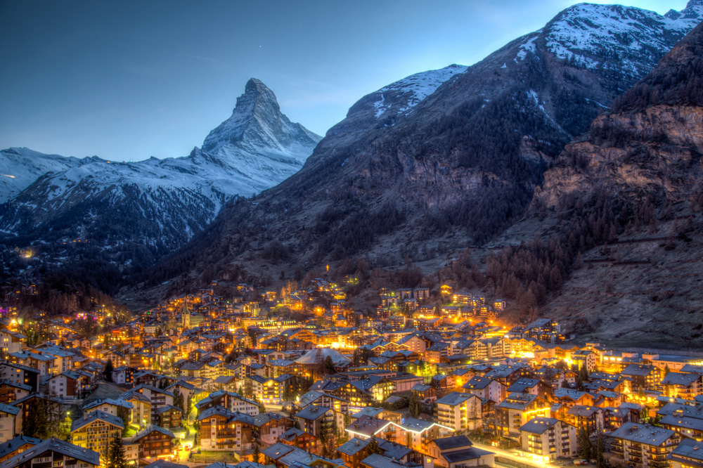 Zermatt is one of the places in Europe that are even better in winter: nestled in the valley of snow capped mountains, the gold lights glow in tis town, setting a holiday tone. 