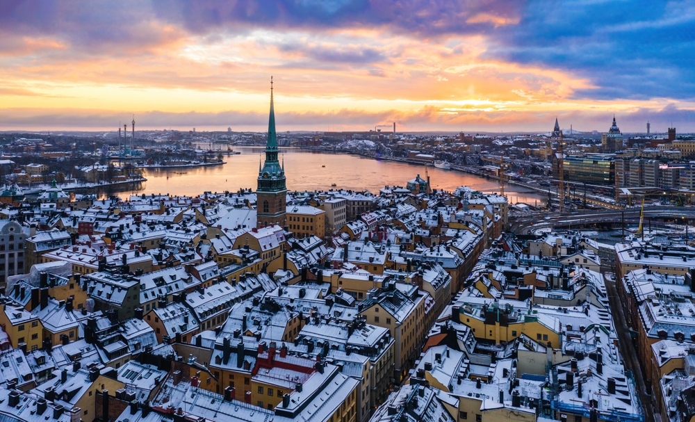 An arial shot of Stockholm shows why this is one of the places in Europe that are even better in winter: the city's sky is warm with yellows and blues but the town is capped with white snow. 