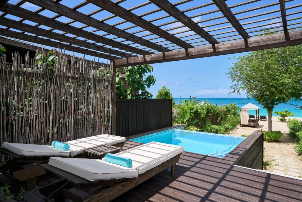 Beach side villa with pool looking out over the ocean. 