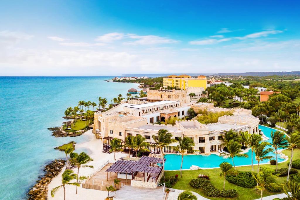 view of a hotel from above with a wrap around pool. It sits right on the ocean. One of the adults-only all inclusive resorts in the Caribbean