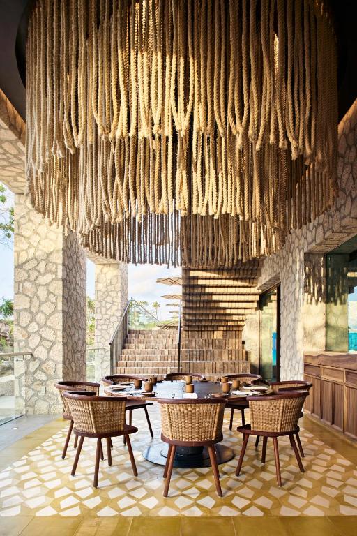 Outside dining space with huge rope chandelier. One of the adults-only all inclusive resorts in the Caribbean