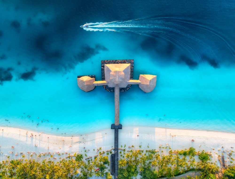 When considering  all inclusives vs cruises, look at rooms: this arial shot shows two private bungalows that sit off a doc on a beach! 