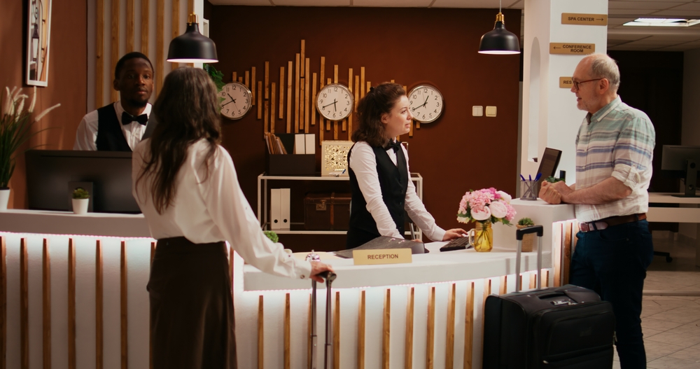 When considering  all inclusives vs cruises, consider what ti takes to get into these places with traveling: in this photo an older gentleman checks in at a front desk with ease. 