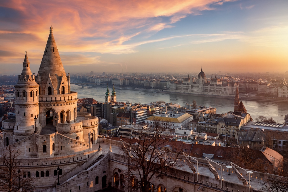 It's a castle on the left with a pointy top you can see the city buildings to the right of it, and in the middle of the image is the Danube river in the background is more city