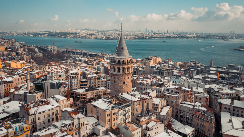 snow covered roofs in istanbul turkey, water in the background 