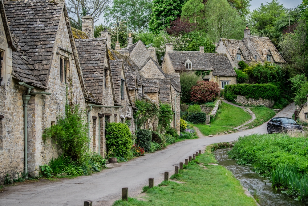 Bibury. Beautiful historical village in England. You can see the cottages and lots of trees. 