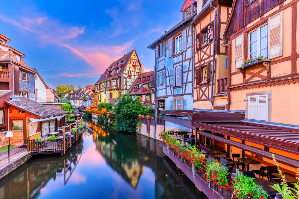 Colmar, Alsace, France. Petite Venice, water canal and traditional half timbered houses.