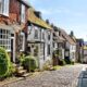 cute town of Rye in Europe with bushes in front of it