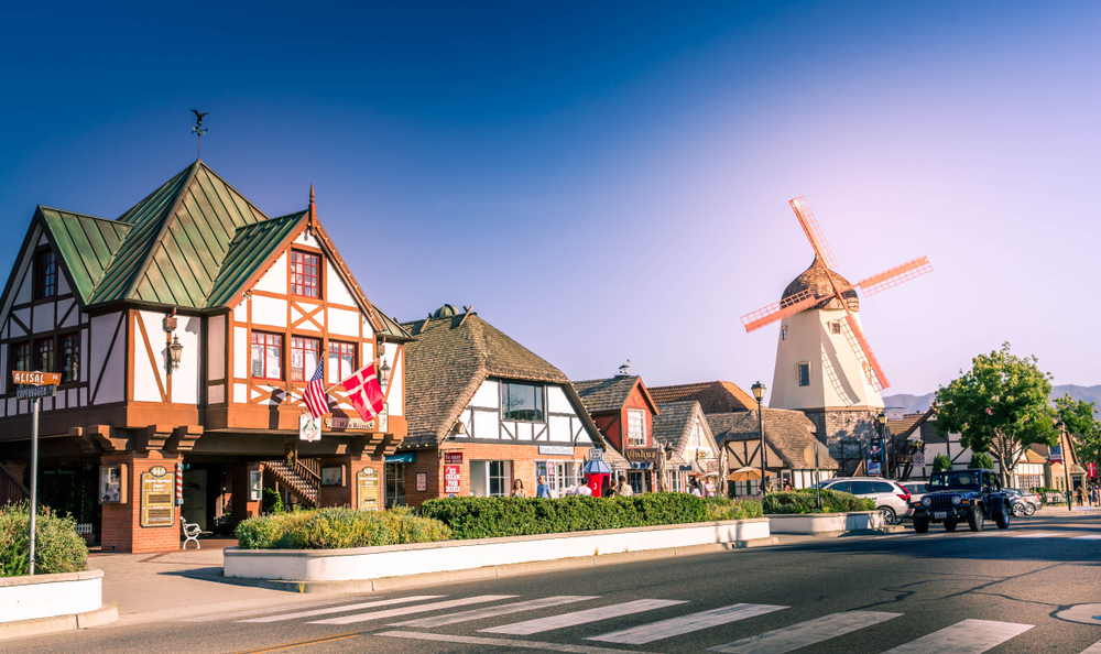 half-timbered houses and a windmill on a street in Solvang, one of the cutest small towns in California