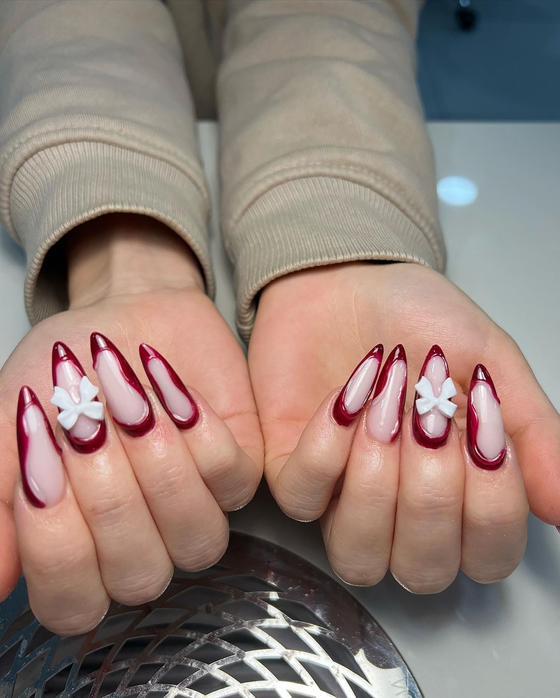 New trendy and simple but looks elegant nails art on young women's hand. 