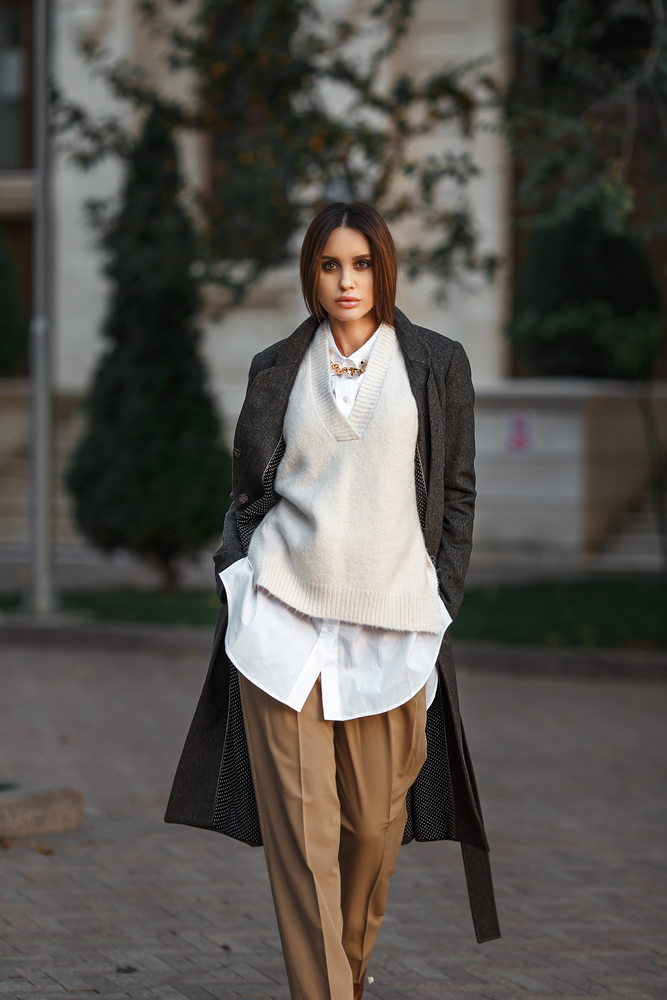 Beautiful girl in cashmere coat walking in the city. street style. Perfect for London outfits in January