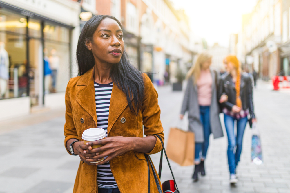 Women in Breton top in London. Article is about  what to wear in London in spring