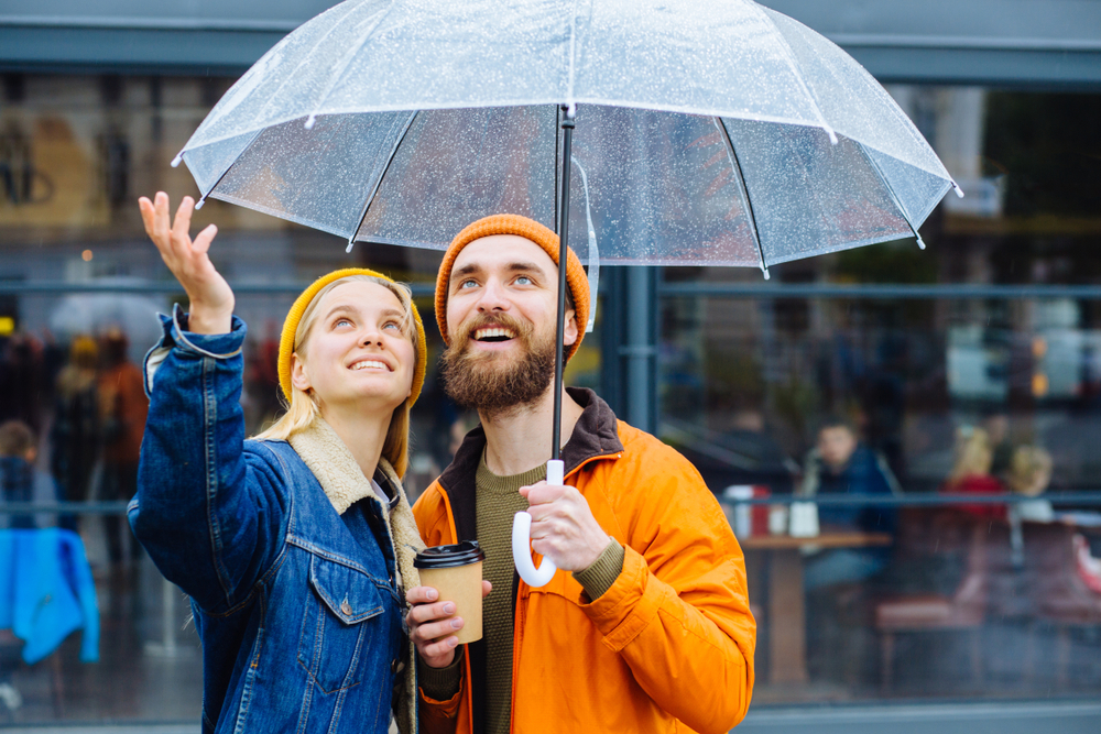 two people with an umbrella 