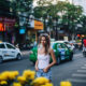 woman standing in a white shirt and jeans in NYC in the summer