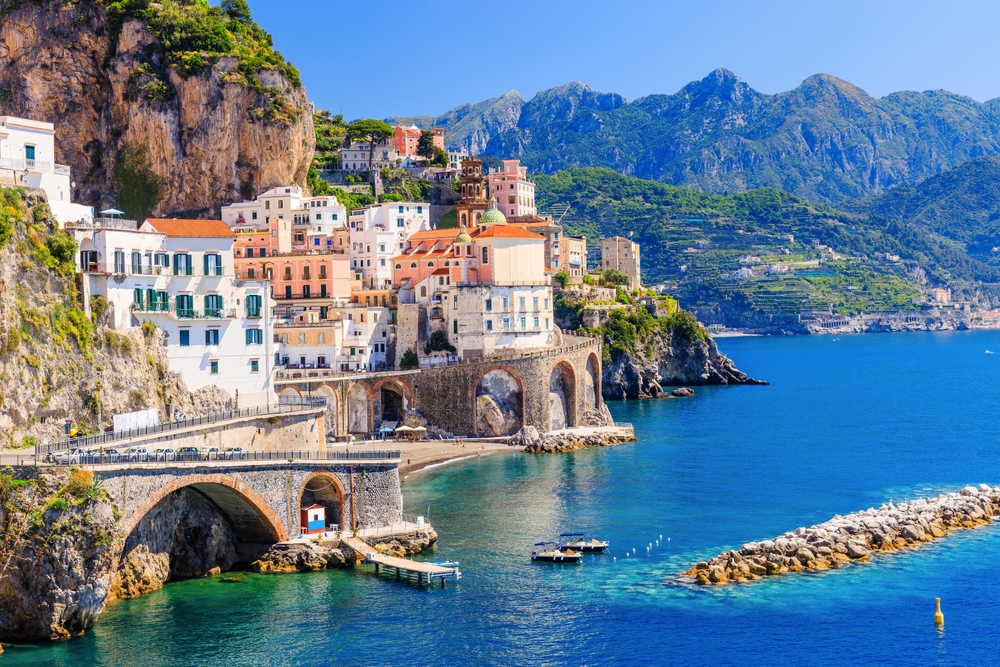 the picturesque beach town of the Amalfi Coast with town built into the hillside overlooking the ocean 