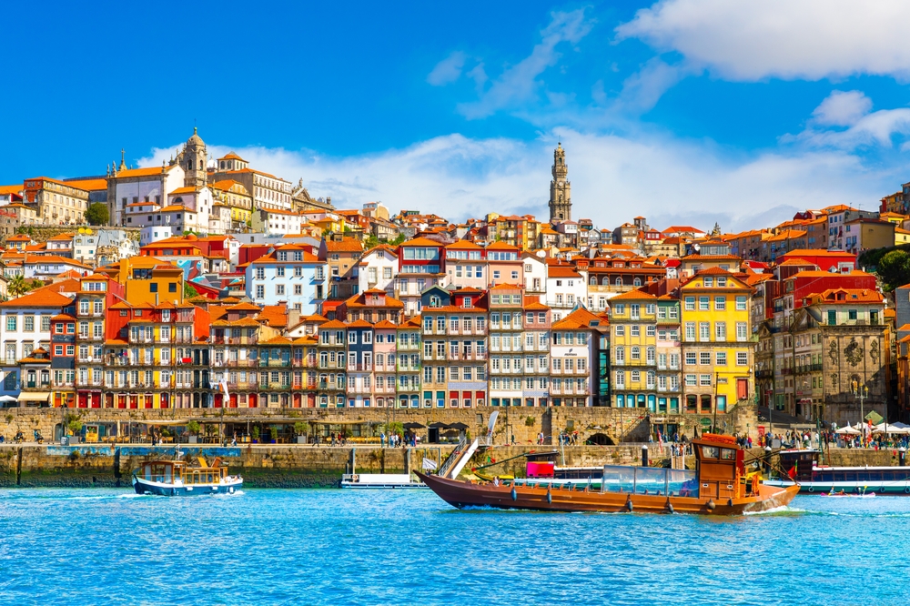 Spain and Portugal is another of the two week Europe Itineary where you see the colorful architecture of Porto Portugal from the waterway 