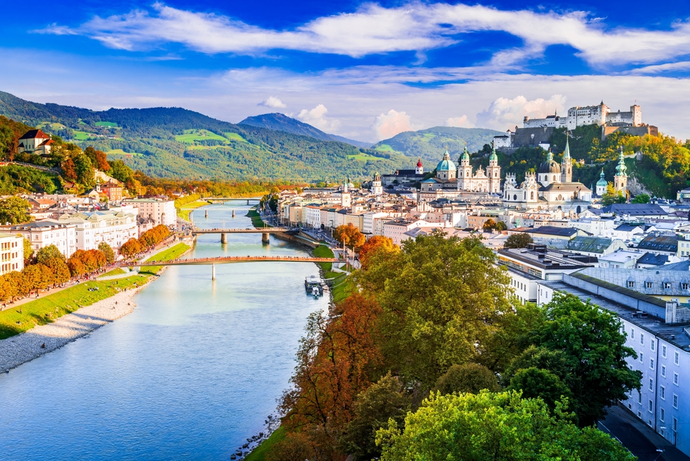 The town of Salzburg  with the river and mountains with the castle in the background on the hillside