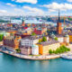 city skyline view of stockholm sweden with beautiful blue river and buildings and blue sky with white clouds