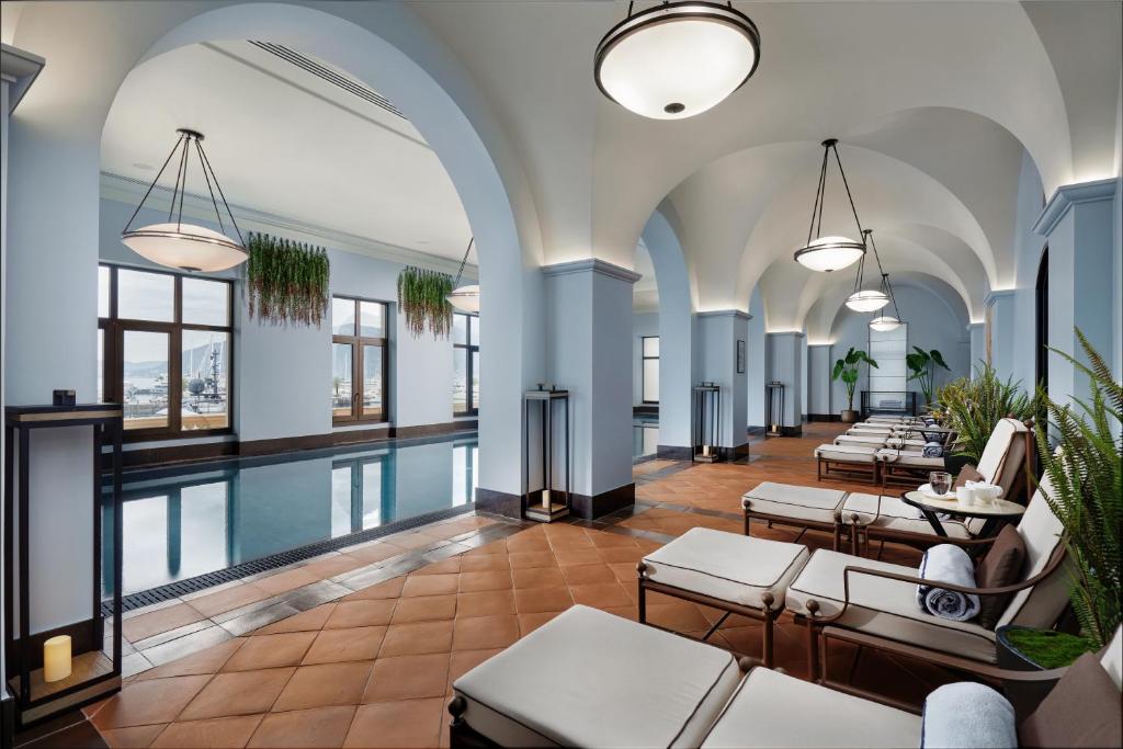 Spa beds around a pool with arches and blue walls. One of the best spa resorts in Europe. 