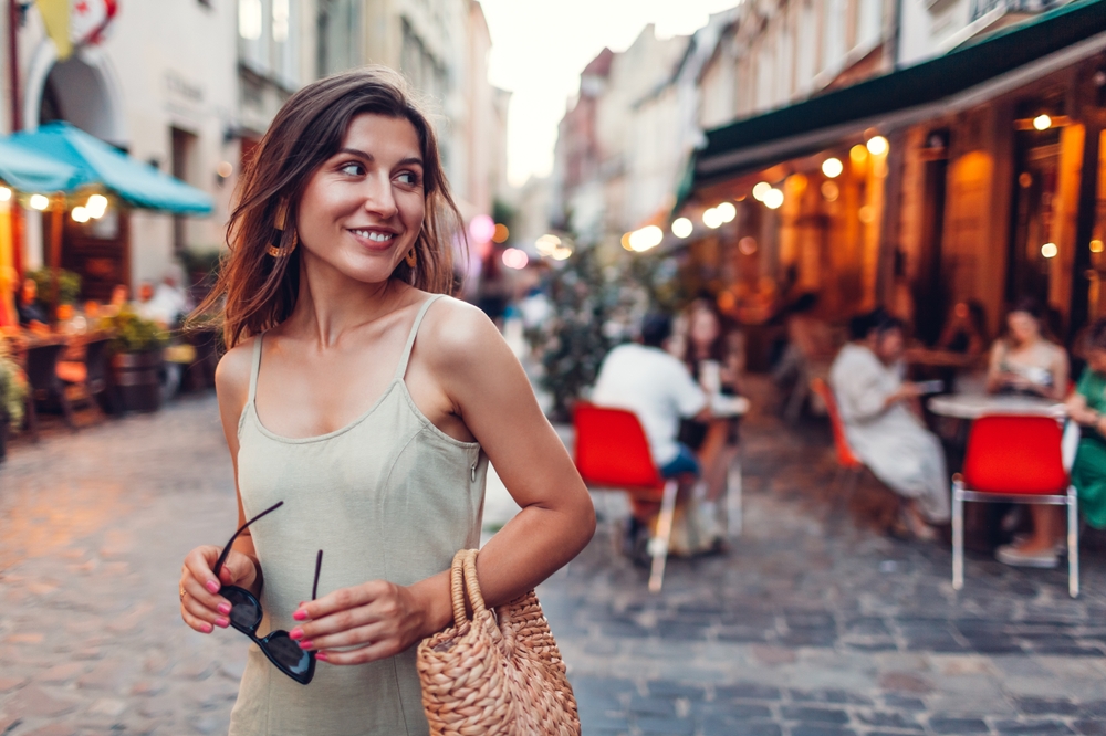 When  what to wear in the city in the summer, channel this girls natural vibe: with dark sunglasses, statement earrings, and a cami-dress that is neutral in color, she looks over her shoulder and laughs while enjoying the city. 