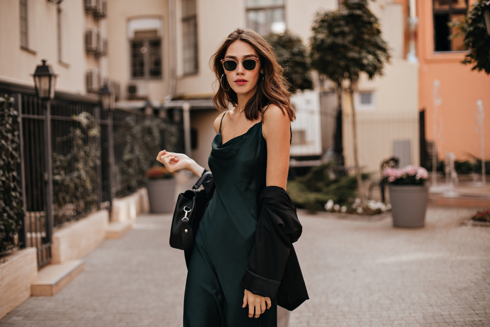 Sometimes the days are so warm that  you can wear silk camisoles or jumpers, like this woman wears with  her blazer and sunglasses. 