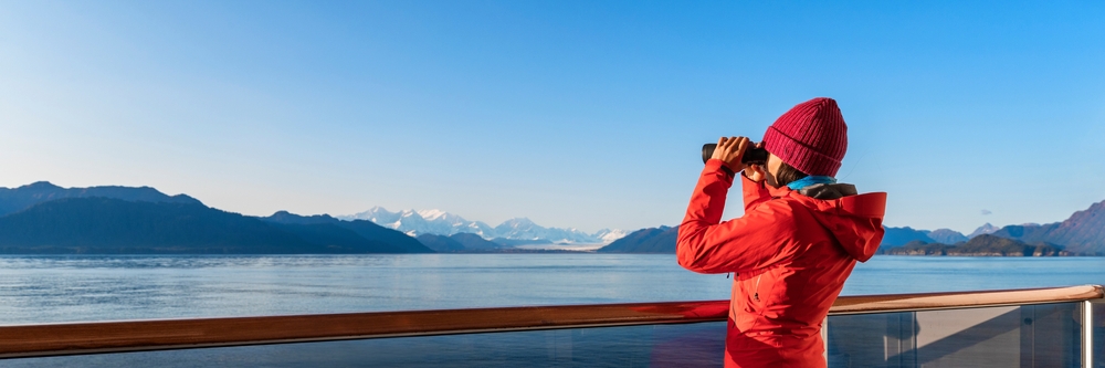 When wondering what to wear on a cruise, don't forget what kind of cruise you're going on, like this lady who is wearing a thermal hat and jacket for her Alaskan adventure. 