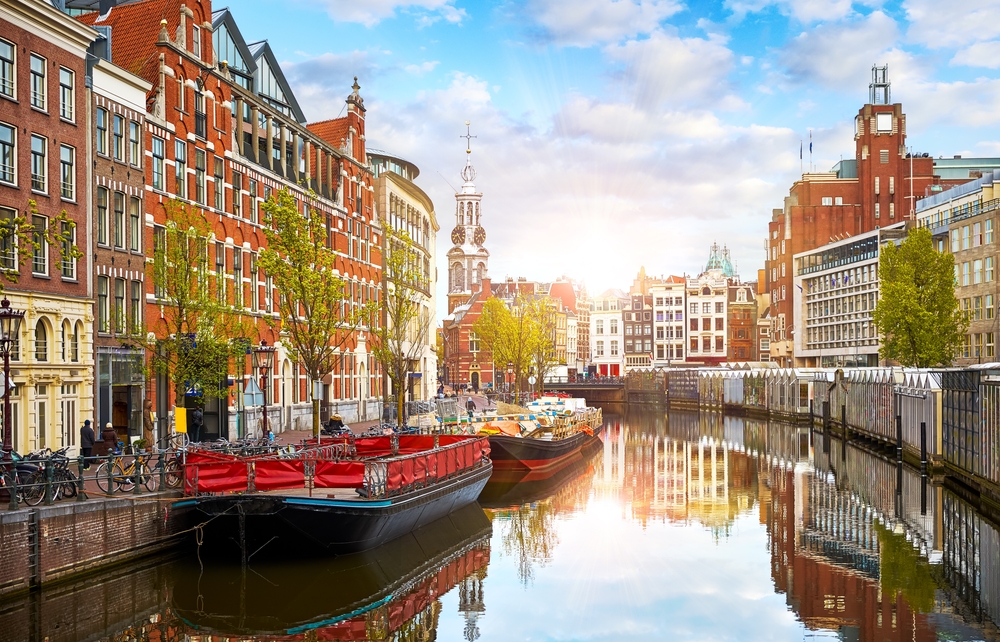 The canal city of Amsterdam with stunning architecture and bridges going over the canal